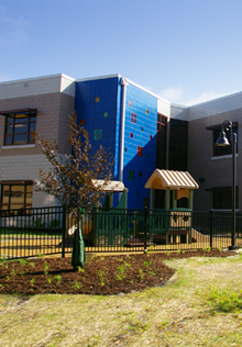 A multi-functional landscape, providing play space and aesthetics, at the Aurora Early Learning Center, a LEED Silver facility