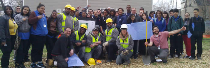 Participants in a ground-breaking celebration for creation of the Richards Career Academy learning landscape, a WRD Environmental project